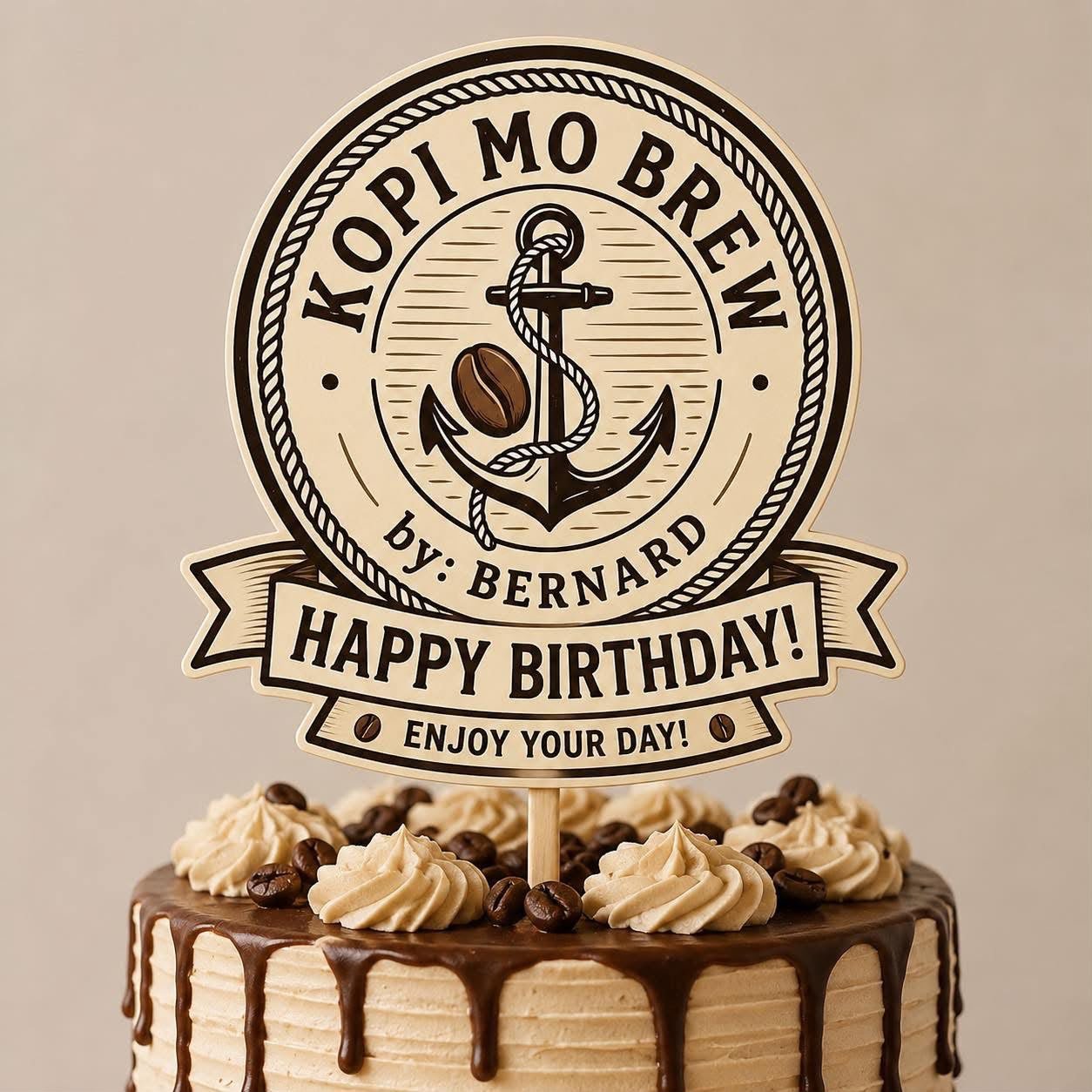 A coffee buttercream cake with a Kopi Mo Brew Happy Birthday topper
